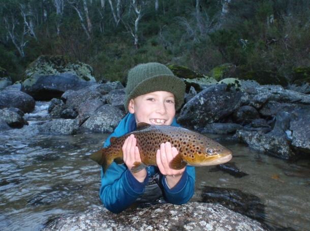 Young fisho Sean Vasquez with his unlucky flathead caught and released at Port Stephens, NSW.